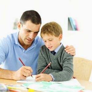 father helping his son with his homework