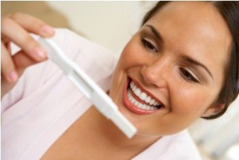 Woman looking at pregnancy test