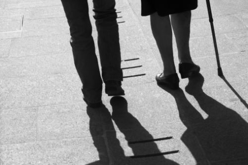 Young and elderly ladies walking